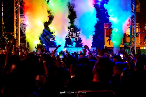 Rainbow-lit CO2 jets blast over a cheering crowd during James Hype's set at The Cuban Club, Ybor City, April 2025